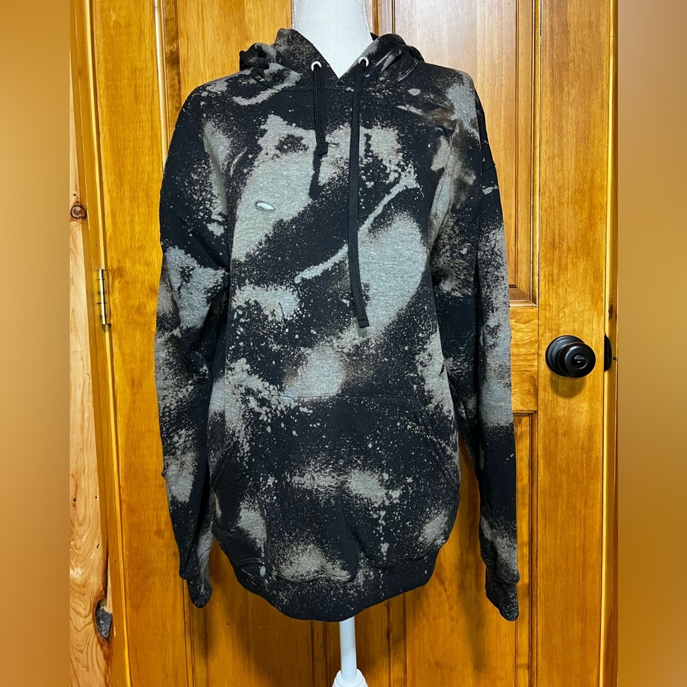 Bleach-dyed, distressed hoodie
